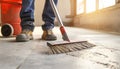 Builder sweeping the floor after renovation of house Royalty Free Stock Photo