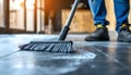 Builder sweeping the floor after renovation of house Royalty Free Stock Photo