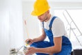 Builder with tablet pc and equipment indoors Royalty Free Stock Photo
