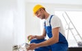 Builder with tablet pc and equipment indoors Royalty Free Stock Photo