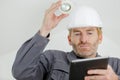 builder with tablet pc and equipment indoors Royalty Free Stock Photo