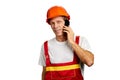 Builder talks on smartphone.