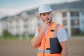 Builder thinking. Construction man in helmet build new house. Engineer work in builder uniform and hard hat. Foreman Royalty Free Stock Photo