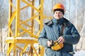 Builder with tower crane remote control equipment Royalty Free Stock Photo