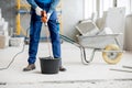 Builder mixing plaster at the construction site Royalty Free Stock Photo