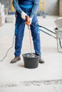 Builder mixing plaster at the construction site Royalty Free Stock Photo