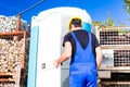 Builder using mobile toilet on site