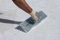 Builder using plastering tool for finishing wall Royalty Free Stock Photo