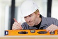 Builder using spirit level Royalty Free Stock Photo