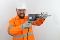 Builder wearing hardhat and reflecting jacket screaming shouting anger rage with drill tool.