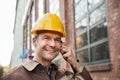 Builder wearing hardhat talking on walkie talkie Royalty Free Stock Photo