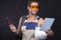 Builder woman. Female worker in uniform. Construction site. Architect engineer with check list Royalty Free Stock Photo