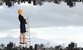 Builder woman ladder . Mixed media Royalty Free Stock Photo