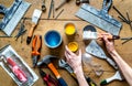 Builder work with professional repairing implements set on wooden background top view