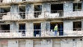 builder at work on the restoration and repair of destroyed houses in the city of Ukraine