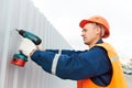 Builder worker assembling metal construction Royalty Free Stock Photo