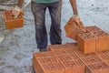 Builder worker carrying hollow clay block Royalty Free Stock Photo