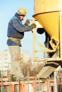 Builder worker at concrete pouring into form Royalty Free Stock Photo