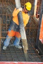 Builder worker at concrete pouring work