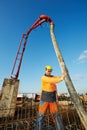 Builder worker at concrete pouring work