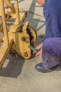 Builder worker greasing parts of the crane 2 Royalty Free Stock Photo