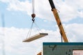 Builder worker installing concrete floor slab panel at building construction site Royalty Free Stock Photo