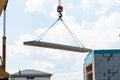 Builder worker installing concrete floor slab panel at building construction site Royalty Free Stock Photo