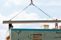 Builder worker installing concrete floor slab panel at building construction site Royalty Free Stock Photo