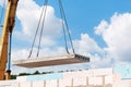 Builder worker installing concrete floor slab panel at building construction site Royalty Free Stock Photo