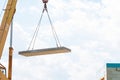 Builder worker installing concrete floor slab panel at building construction site Royalty Free Stock Photo