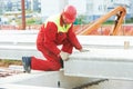 Builder worker installing concrete slab Royalty Free Stock Photo