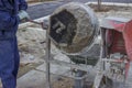 Builder Worker Mixing Cement