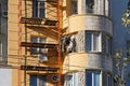 Builder worker painting facade of building house in Volgograd Royalty Free Stock Photo