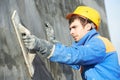 Builder worker at plastering facade work Royalty Free Stock Photo