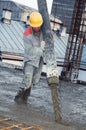 Builder worker pouring concrete Royalty Free Stock Photo