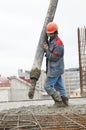 Builder worker pouring concrete Royalty Free Stock Photo