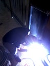 The builder is working. electrician fixing wires. welding. lights come out. Royalty Free Stock Photo