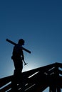 Builder working late on top of building