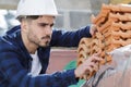 Builder working on roof new building Royalty Free Stock Photo