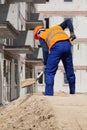 Builder working using shovel