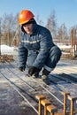 Builder works with concrete reinforcement Royalty Free Stock Photo