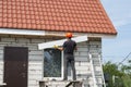 Builder works on the roof Royalty Free Stock Photo