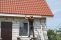 Builder works on the roof Royalty Free Stock Photo