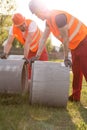 Builders and concrete pipes Royalty Free Stock Photo