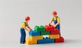 Builders create a colorful structure with toy blocks in a playful construction scene Royalty Free Stock Photo