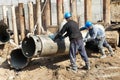 Builders with equipment for piling Royalty Free Stock Photo