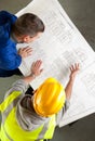 Builders examine blueprints