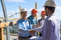 Builders Handshake, Two Happy Smiling Partners Shaking Hand After Meeting With Foreman Team On Site Royalty Free Stock Photo