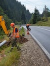 Builders installing new utility poles Royalty Free Stock Photo