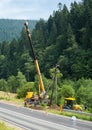 Builders installing new utility poles Royalty Free Stock Photo